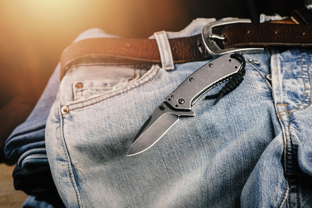 Pocketknife with old jeans in the background pocketknife is one of every day carry EDC item for men