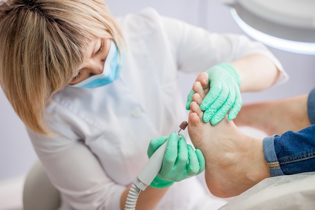 Podiatry doctor treating feet and nails