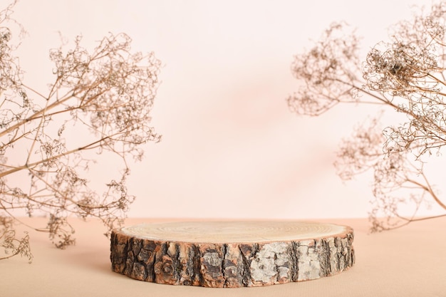 podium made of natural wood with dried flowers on a beige background minimalistic branding scene