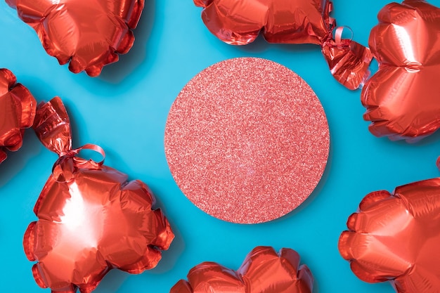 Podium or pedestal and gift box with red heart shape baloons on turquoise background Valentines Day temlate