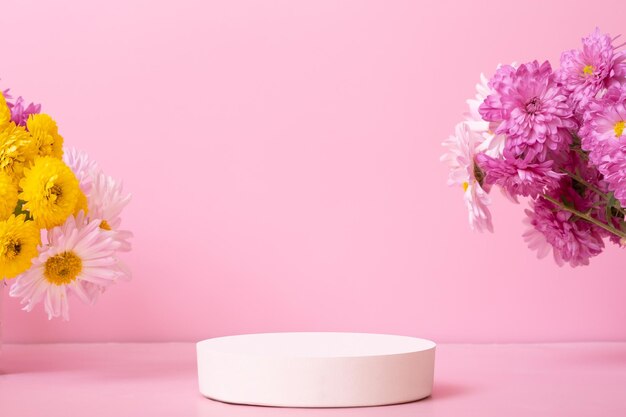 Podium or pedestal with chrysanthemum flower and decorative bicycle Mockup of your cosmetic products