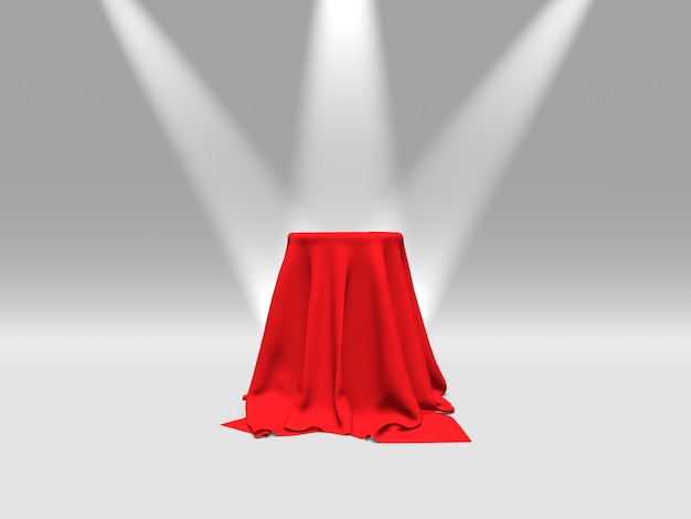 Photo podium or platform covered with red cloth illuminated by spotlights