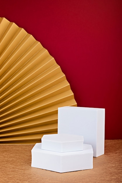 Podium, stand, platform for product presentation.Decorative paper fans