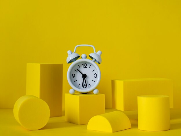 Podium with geometric shapes and clocks