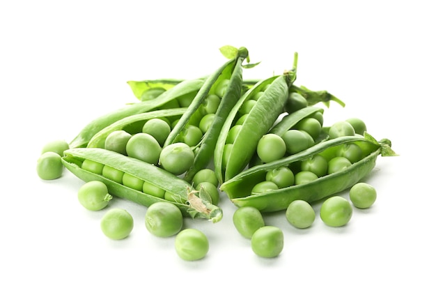 Pods with fresh green peas on white