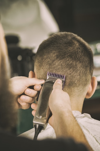 Point of view. Closeup shot of a barber using trimmer