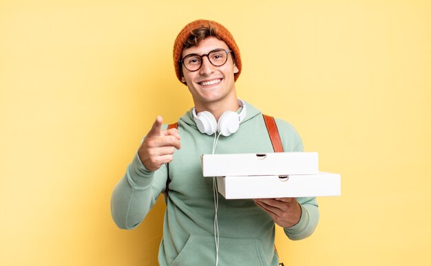 Pointing at camera with a satisfied, confident, friendly smile, choosing you. pizza concept