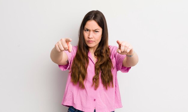 Pointing forward at camera with both fingers and angry expression telling you to do your duty