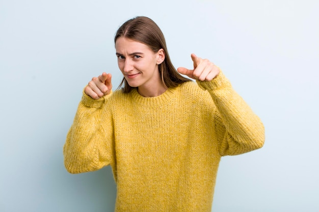 Pointing forward at camera with both fingers and angry expression telling you to do your duty