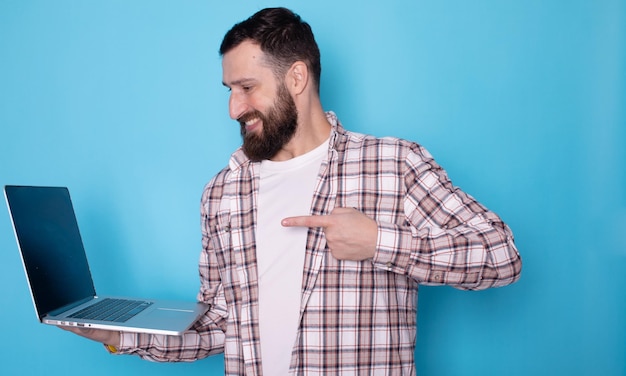 Pointing index finger on laptop pc computer