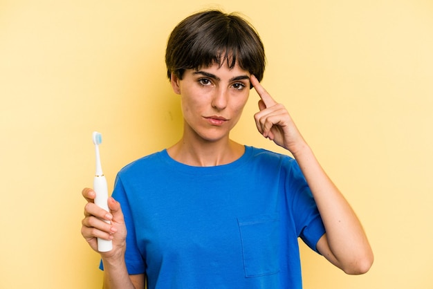 Pointing temple with finger thinking focused on a task