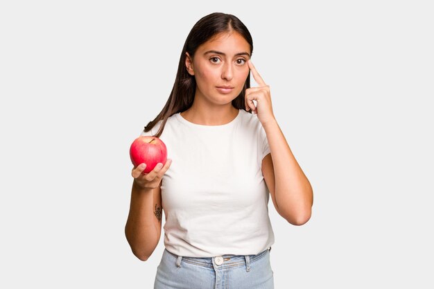 Pointing temple with finger thinking focused on a task