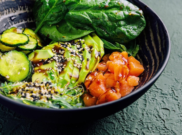 Poke bowl with salmon avocado and cucumber