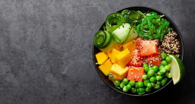 Poke bowl with salmon cucumber and mango