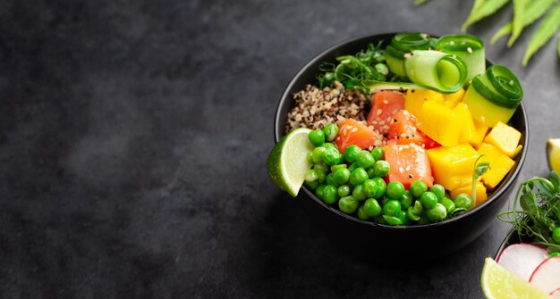 Poke bowl with salmon cucumber and mango