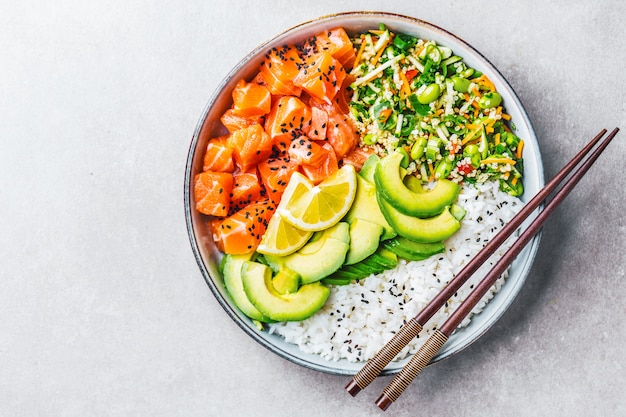 Poke bowl with salmon served in bowl