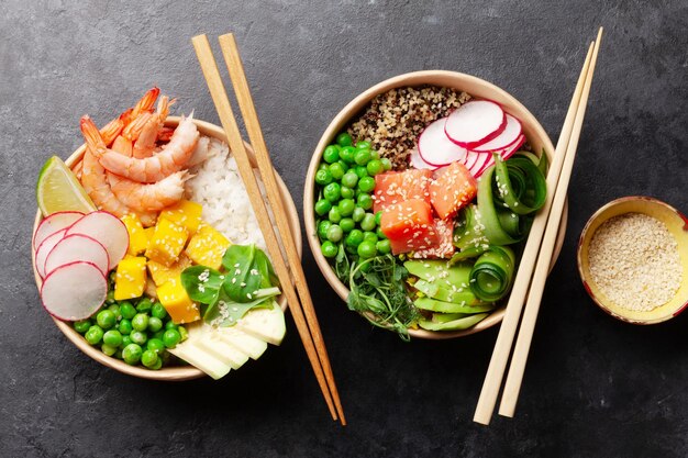 Poke bowls with shrimps salmon avocado and mango