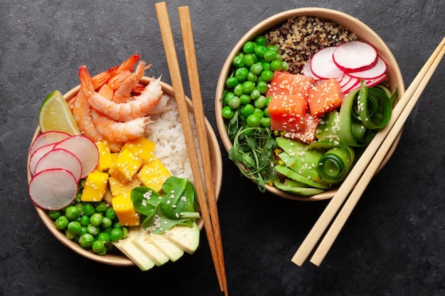 Poke bowls with shrimps salmon avocado and mango