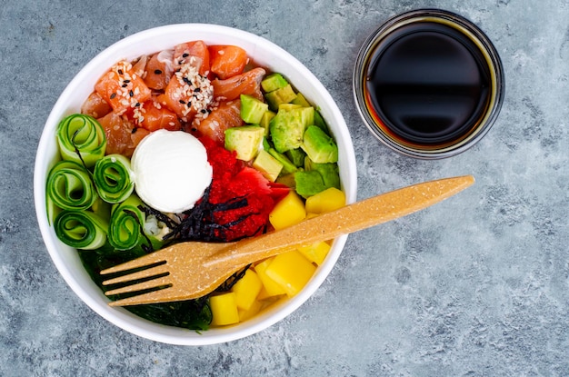 Poke with vegetables and fresh salmon. Studio Photo