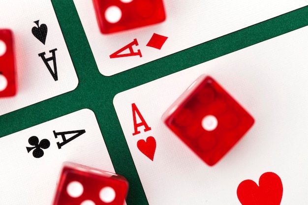 Poker cards and dice on a green background