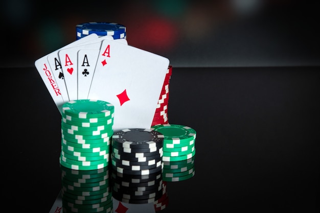 Poker cards with five of a kind combination Closeup of playing cards and chips in poker club