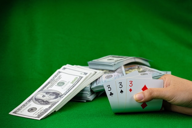 Poker casino gambling and the money stack of 100 US dollars banknotes