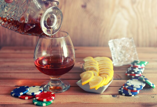 Poker chip and brandy glass