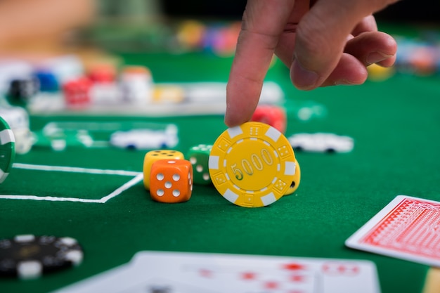 Poker chips and cards on the cloth