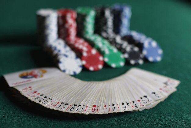 Poker chips and cards on the cloth