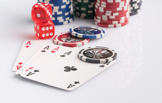 Poker chips cards and dice on a white background The concept of gambling and entertainment