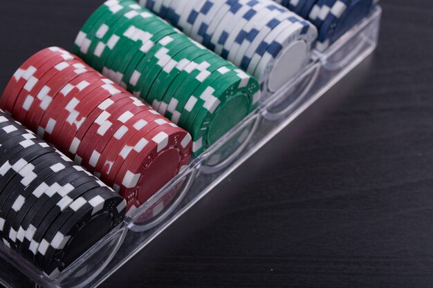 Poker chips for casino game on the table.