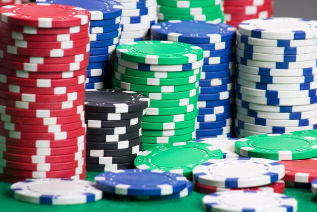 Photo poker chips on a green casino felt