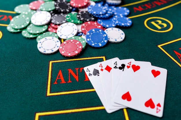 Poker chips on a poker table at the casino. Closeup. quads, a winning combination. Chips winner