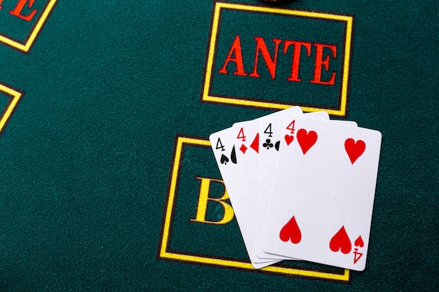 Poker chips on a poker table at the casino. Closeup. quads, a winning combination.