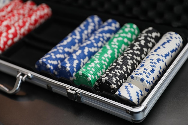 poker chips in a silver tray with poker chips in the middle.