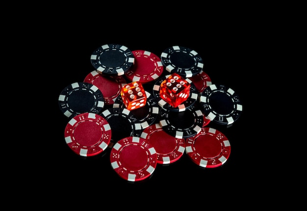 Poker dice and chips on black background craps club game\
concept poker game