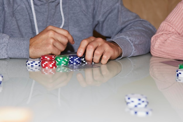 Poker game concept with chips cards on the table Enjoying the moment digital detox with friends Selective focus High quality photo