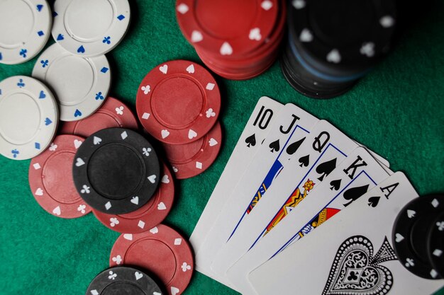 Photo poker hands, royal flush 3. five playing cards - the poker royal flush hand on casino table.
