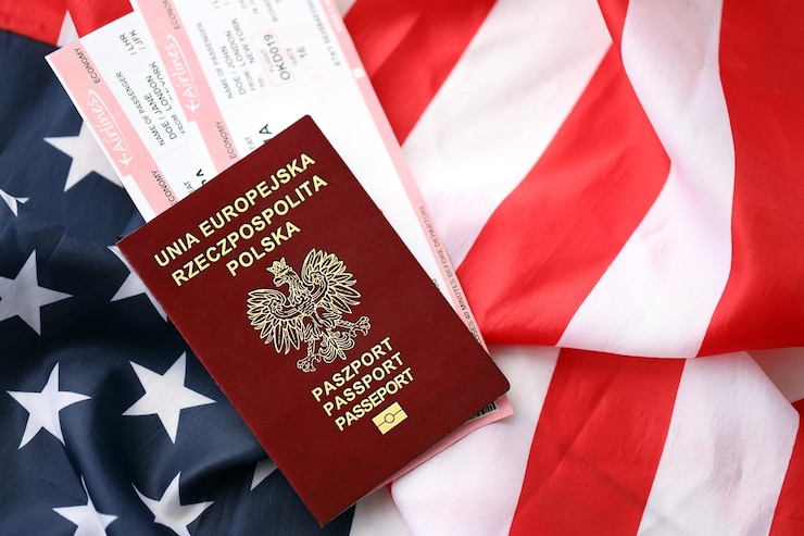 Photo poland passport with airline tickets on american us flag close up tourism and travel concept