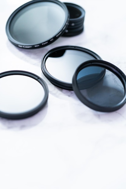 Photo polarized and neutral density filters on a white table.