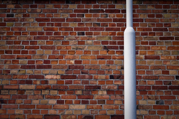 pole against brick wall