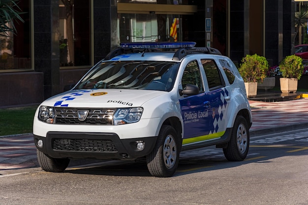 Photo a police car with the words policia local on the door spain blanes