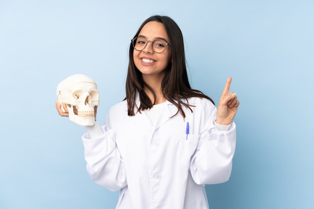 Police forensic specialist woman showing and lifting a finger in sign of the best