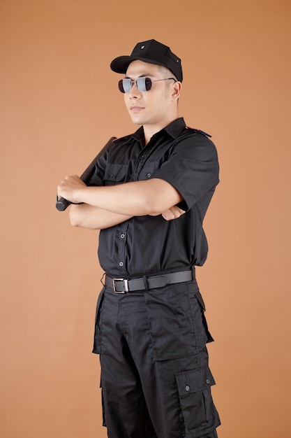 Police Officer in Sunglasses and Uniform