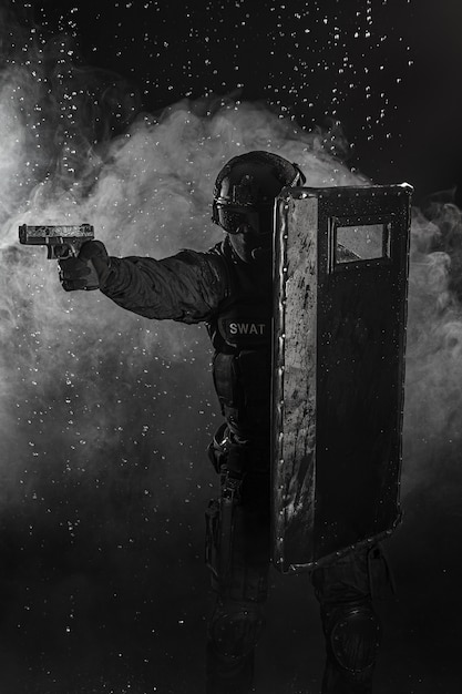 police officer with ballistic shield