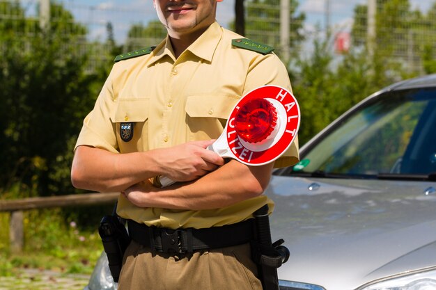 Police, policeman or cop stop car