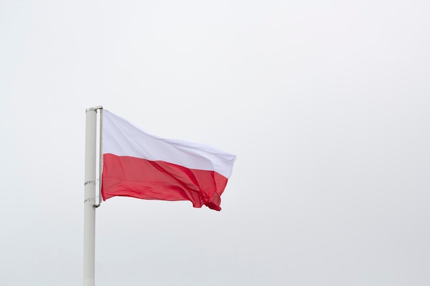 A Polish flag flies on a pole