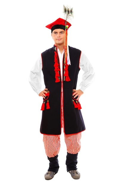 a Polish man in traditional outfit standing over white background