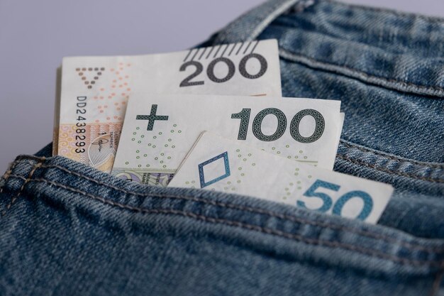 Photo polish zloty money cash in a jeans pocket