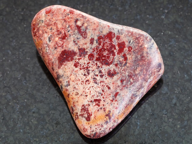 Polished Brecciated Jasper stone on dark